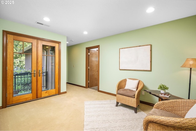 sitting room featuring light carpet, french doors, recessed lighting, baseboards, and visible vents