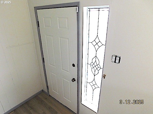 doorway with wood finished floors