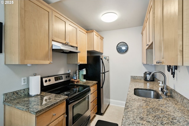 1509 NE 10th Ave Unit 105, Portland, OR 97232 - kitchen with under cabinet range hood, appliances with stainless steel finishes, light brown cabinets, and stone counters