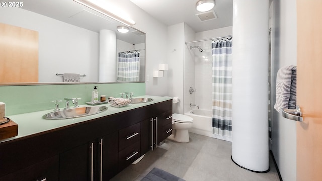 1400 NW Irving St Unit 715, Portland, OR 97209 - bathroom with double vanity, shower / bathtub combination with curtain, and toilet