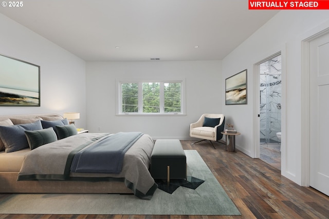 bedroom with dark hardwood / wood-style flooring