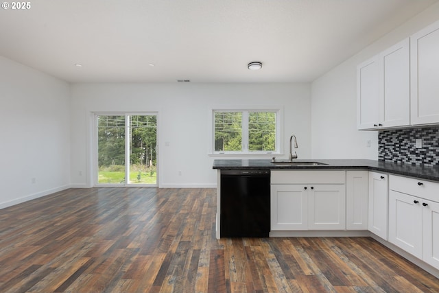 kitchen featuring tasteful backsplash, white cabinetry, black dishwasher, sink, and dark wood-type flooring