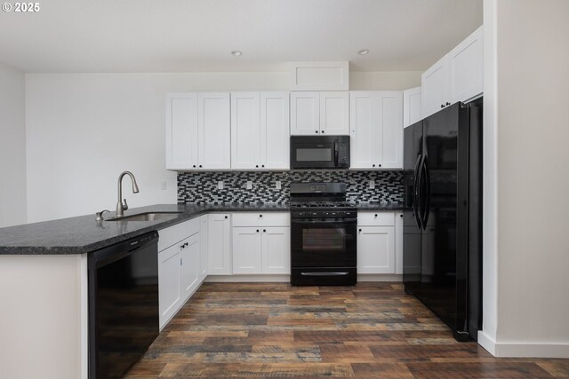 kitchen with sink, white cabinetry, backsplash, black appliances, and kitchen peninsula