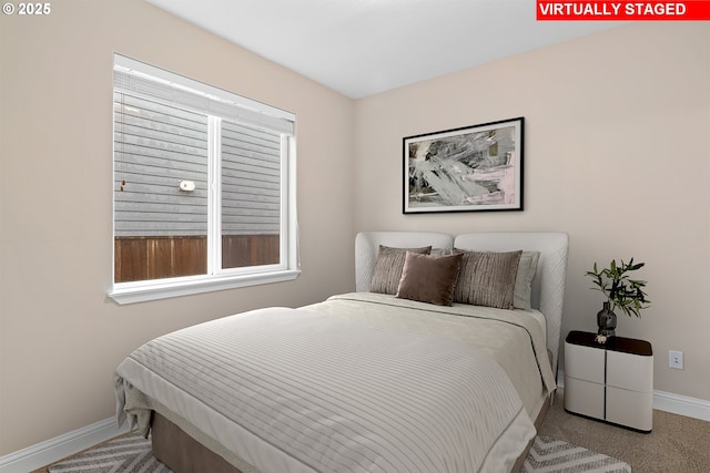 carpeted bedroom with multiple windows