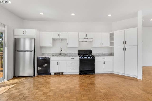 2689 Cupola Dr, Eugene, OR 97403 - kitchen with black appliances, under cabinet range hood, white cabinetry, open shelves, and light stone counters