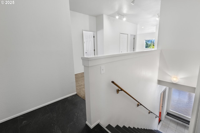 2689 Cupola Dr, Eugene, OR 97403 - staircase featuring baseboards and track lighting