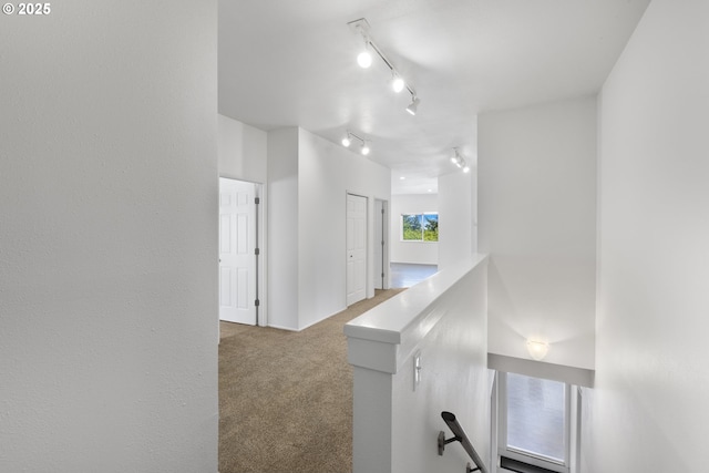 2689 Cupola Dr, Eugene, OR 97403 - hall with an upstairs landing, carpet flooring, and rail lighting
