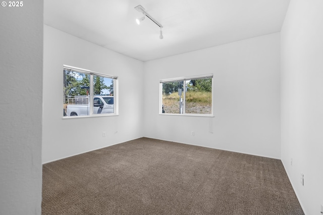 2689 Cupola Dr, Eugene, OR 97403 - spare room with plenty of natural light, carpet floors, and track lighting