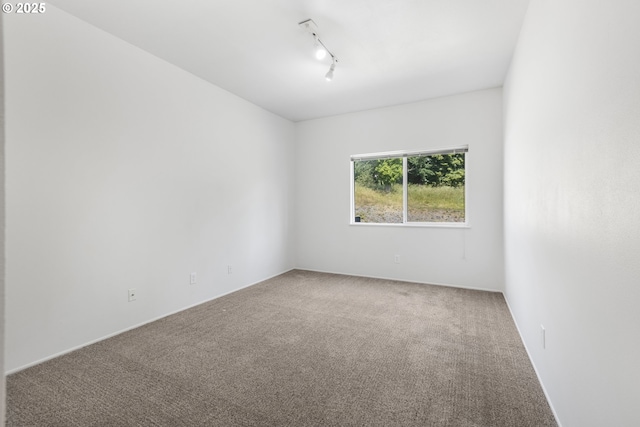 2689 Cupola Dr, Eugene, OR 97403 - carpeted spare room with rail lighting