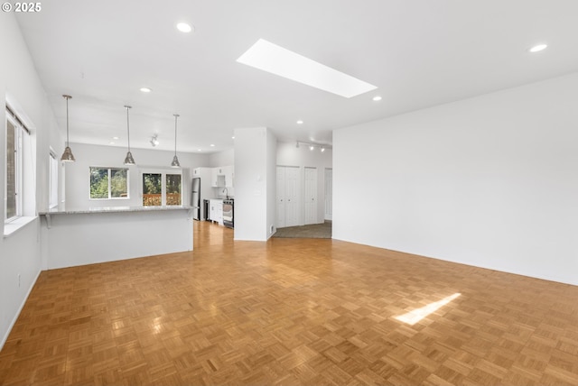 2689 Cupola Dr, Eugene, OR 97403 - unfurnished living room with recessed lighting and a skylight
