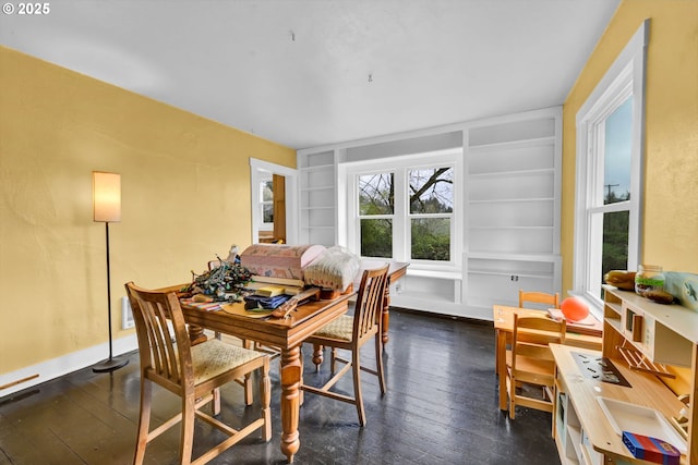 80388 Territorial Hwy, Eugene, OR 97405 - dining room featuring dark wood-style floors, built in shelves, and baseboards