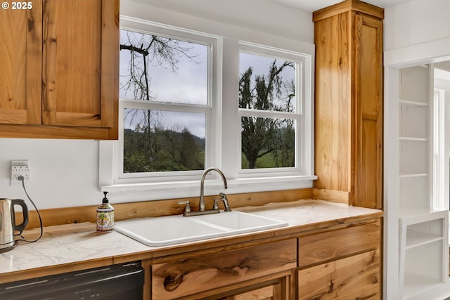 80388 Territorial Hwy, Eugene, OR 97405 - kitchen featuring dishwasher, a sink, brown cabinetry, light countertops, and plenty of natural light