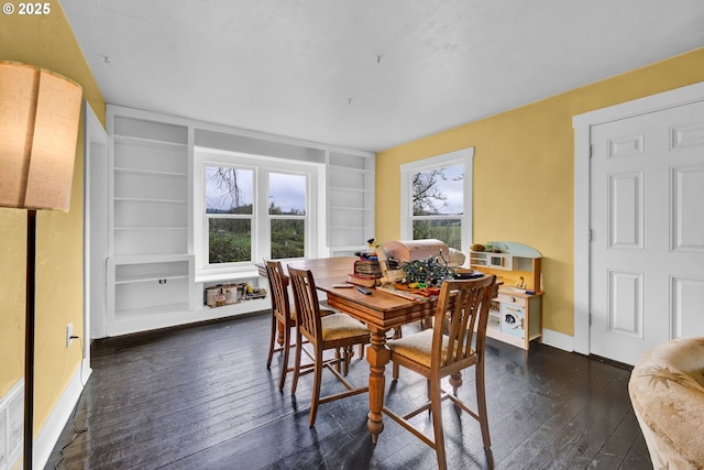 80388 Territorial Hwy, Eugene, OR 97405 - dining room with built in shelves, dark wood-style floors, baseboards, and healthy amount of natural light
