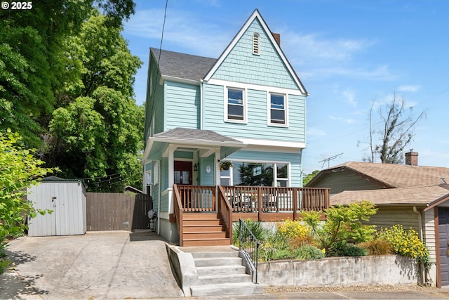 17 S Curry St, Portland, OR 97239 - view of front of property with a gate and roof with shingles