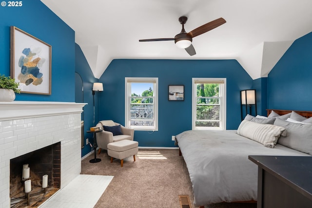 17 S Curry St, Portland, OR 97239 - bedroom with lofted ceiling, carpet, a brick fireplace, baseboards, and ceiling fan