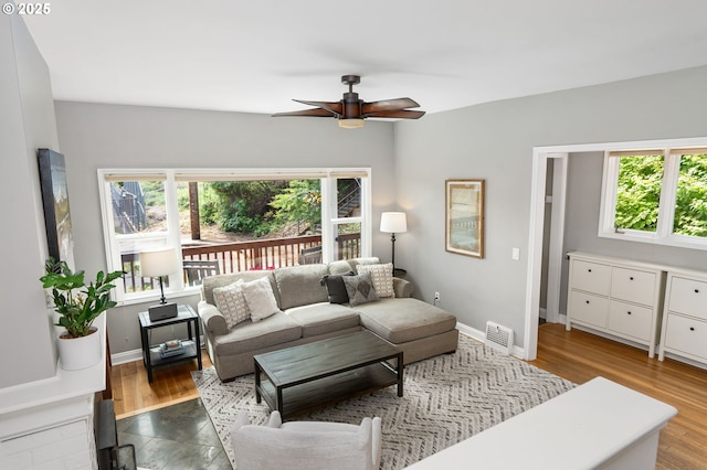 17 S Curry St, Portland, OR 97239 - living room featuring ceiling fan, baseboards, and wood finished floors