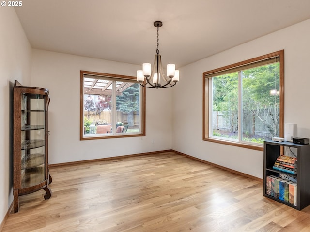 29643 SW Young Way, Wilsonville, OR 97070 - spare room with a chandelier, healthy amount of natural light, and light wood finished floors