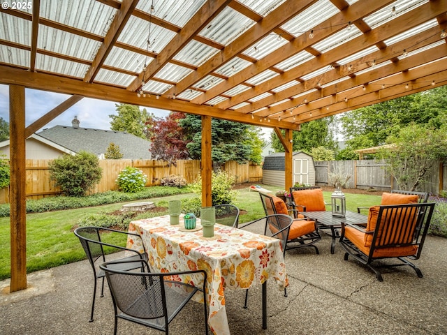 29643 SW Young Way, Wilsonville, OR 97070 - fenced backyard with a storage shed, outdoor dining area, a patio, and a pergola