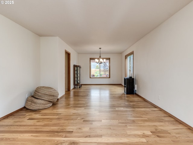 29643 SW Young Way, Wilsonville, OR 97070 - unfurnished room with a chandelier and light wood-style floors