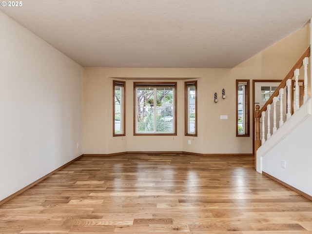 29643 SW Young Way, Wilsonville, OR 97070 - entryway with light wood finished floors, plenty of natural light, and stairs