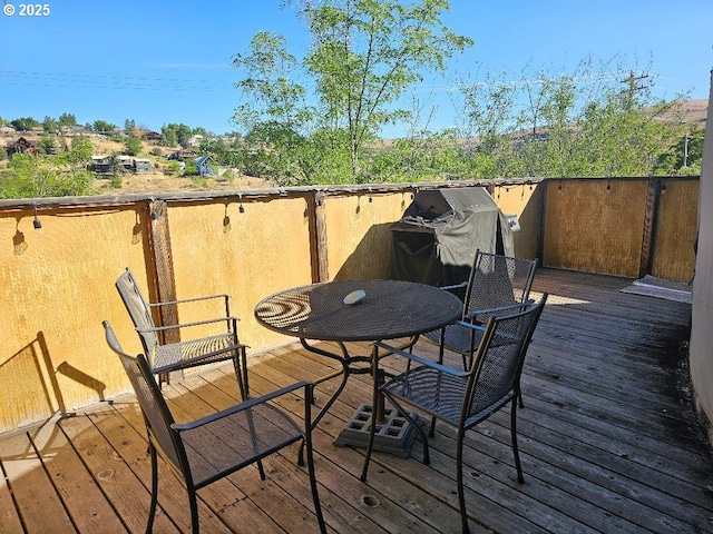 wooden deck with outdoor dining area