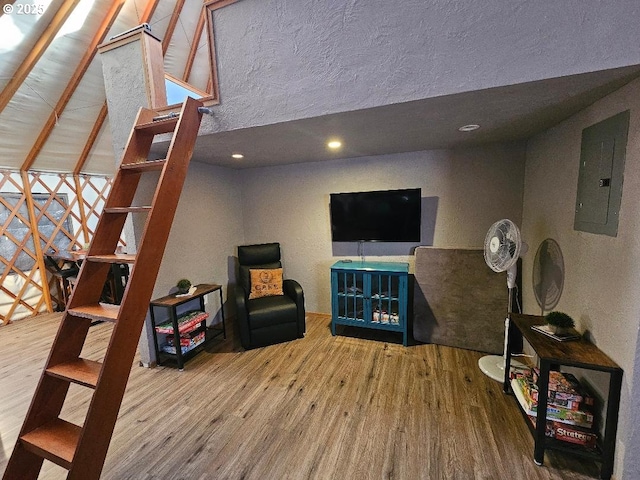 sitting room with wood finished floors and electric panel