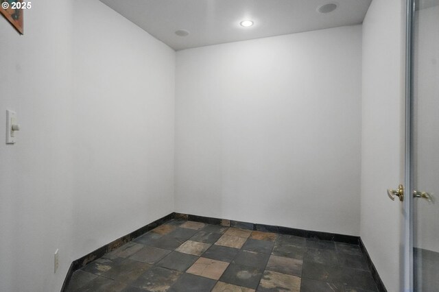 50 SE Avondale Ct, Gresham, OR 97080 - empty room featuring baseboards, dark stone finish flooring, and recessed lighting