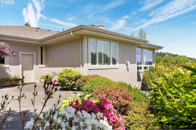 50 SE Avondale Ct, Gresham, OR 97080 - view of home's exterior featuring a chimney