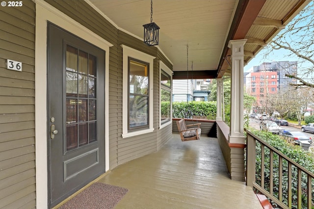 property entrance featuring covered porch