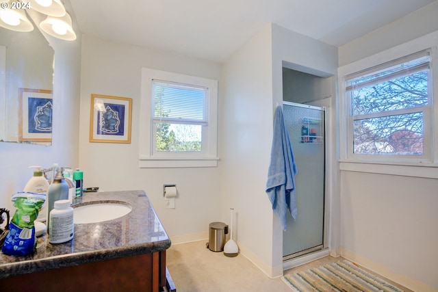 bathroom featuring vanity and walk in shower