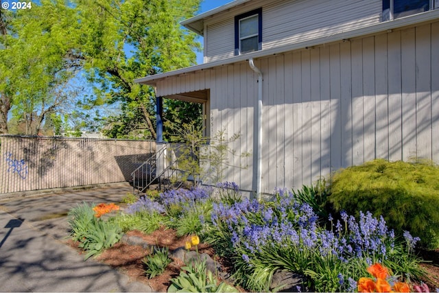 doorway to property featuring fence