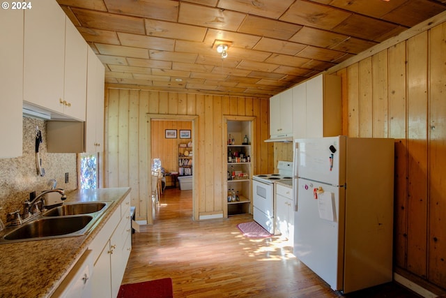 kitchen featuring white appliances, a sink, wood ceiling, backsplash, and light countertops