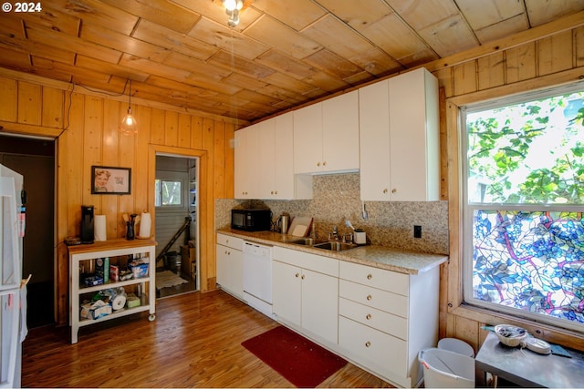 kitchen featuring white appliances, a sink, under cabinet range hood, wood ceiling, and white cabinets