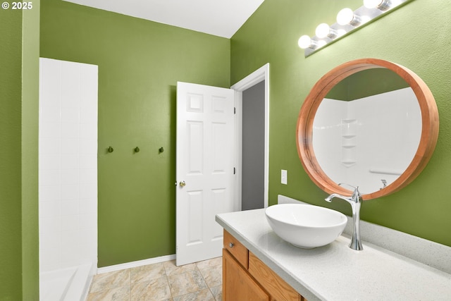 bathroom featuring vanity and baseboards