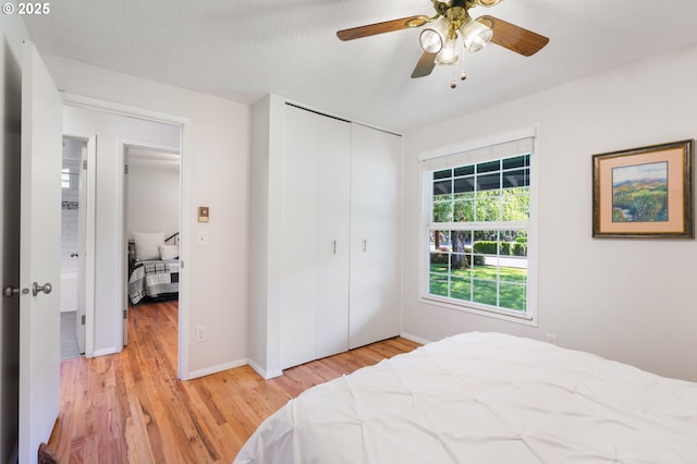 18344 Terry Ave, Lake Oswego, OR 97035 - bedroom with light wood-style floors, a closet, baseboards, and a ceiling fan