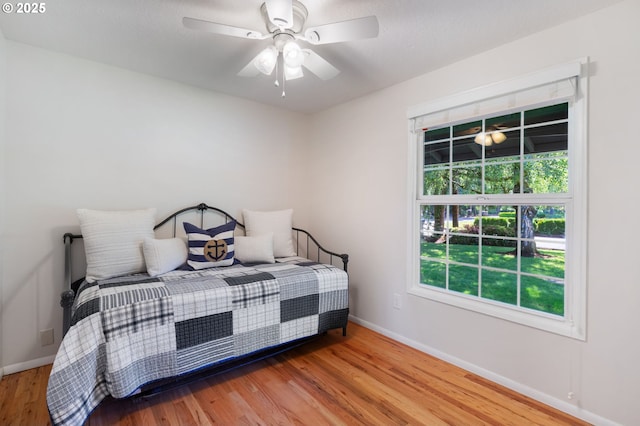 18344 Terry Ave, Lake Oswego, OR 97035 - bedroom with baseboards, wood finished floors, and ceiling fan