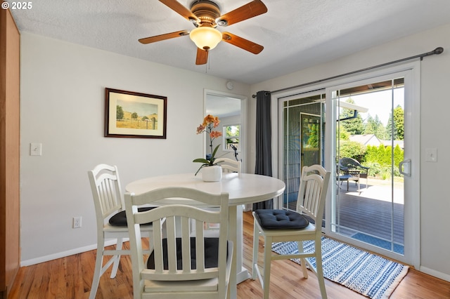 18344 Terry Ave, Lake Oswego, OR 97035 - dining space with baseboards, light wood-style flooring, a ceiling fan, and a textured ceiling