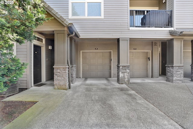 595 Springtree Ln, West Linn, OR 97068 - entrance to property with an attached garage, driveway, and stone siding