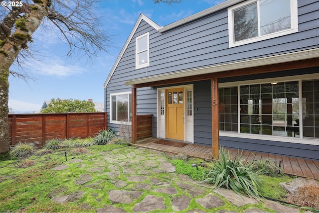 rear view of property with fence