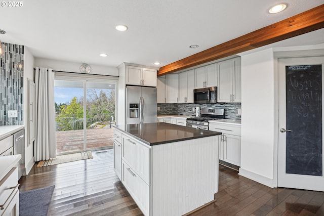 kitchen featuring dark wood-style flooring, tasteful backsplash, recessed lighting, appliances with stainless steel finishes, and beamed ceiling