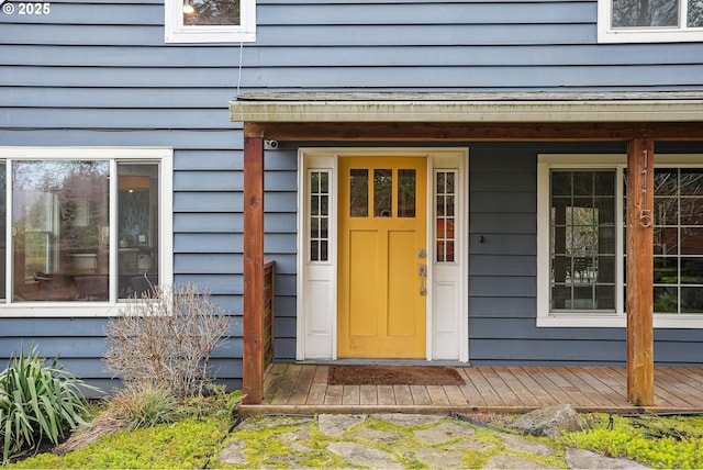 view of exterior entry with covered porch