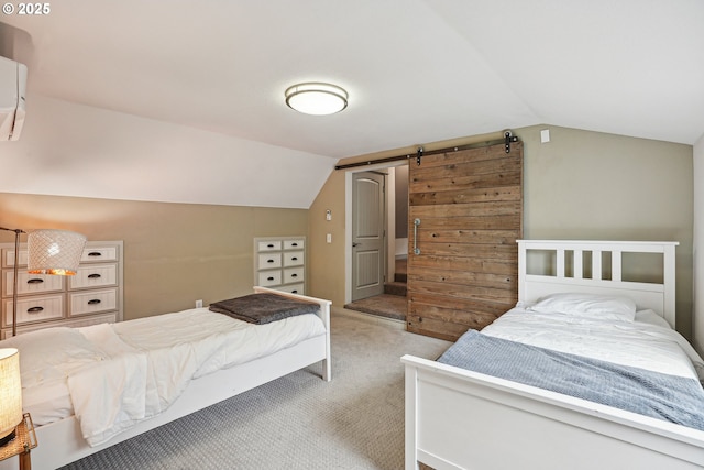 carpeted bedroom featuring a barn door and vaulted ceiling