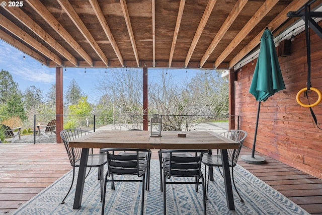 deck with outdoor dining area