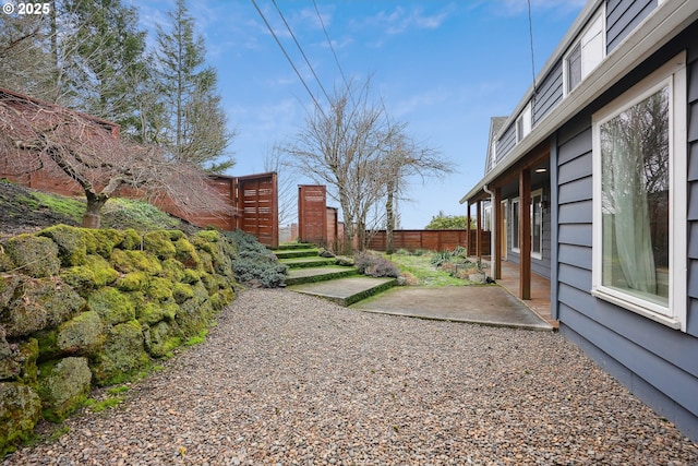 view of yard with a patio area and fence