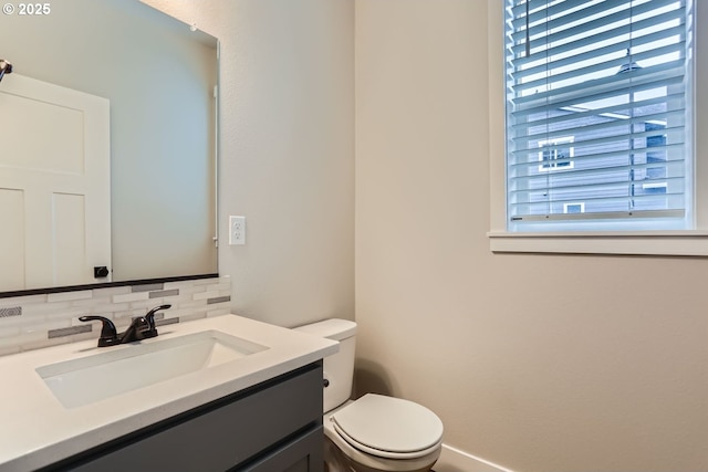 22410 SW Forest Creek Way, Sherwood, OR 97140 - bathroom with decorative backsplash, vanity, toilet, and baseboards