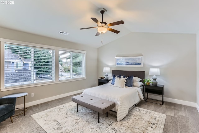 carpeted bedroom featuring lofted ceiling and ceiling fan