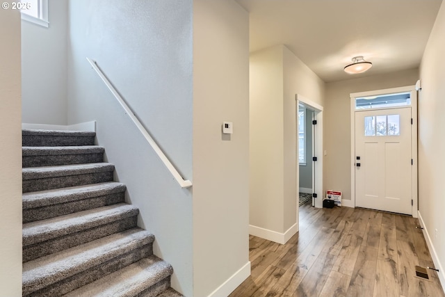 22410 SW Forest Creek Way, Sherwood, OR 97140 - entrance foyer with light wood-style floors, stairway, and baseboards