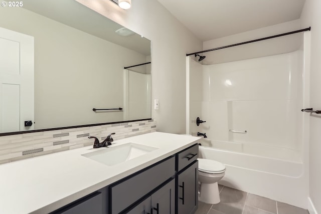 full bathroom featuring shower / bath combination, tile patterned flooring, tasteful backsplash, vanity, and toilet