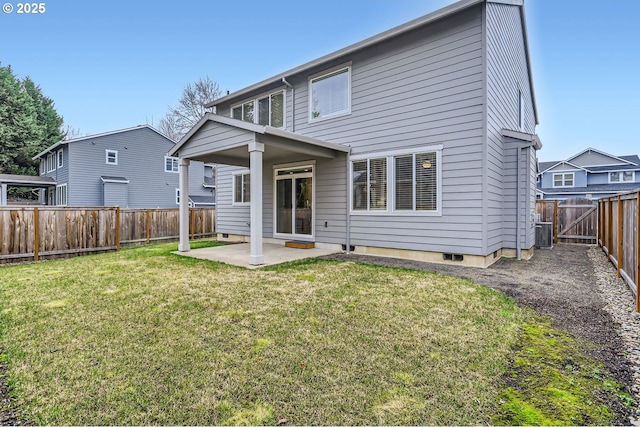 rear view of property featuring central AC unit, a patio area, and a lawn