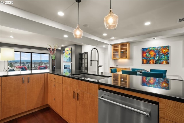 kitchen with dark hardwood / wood-style floors, dishwasher, sink, and decorative light fixtures